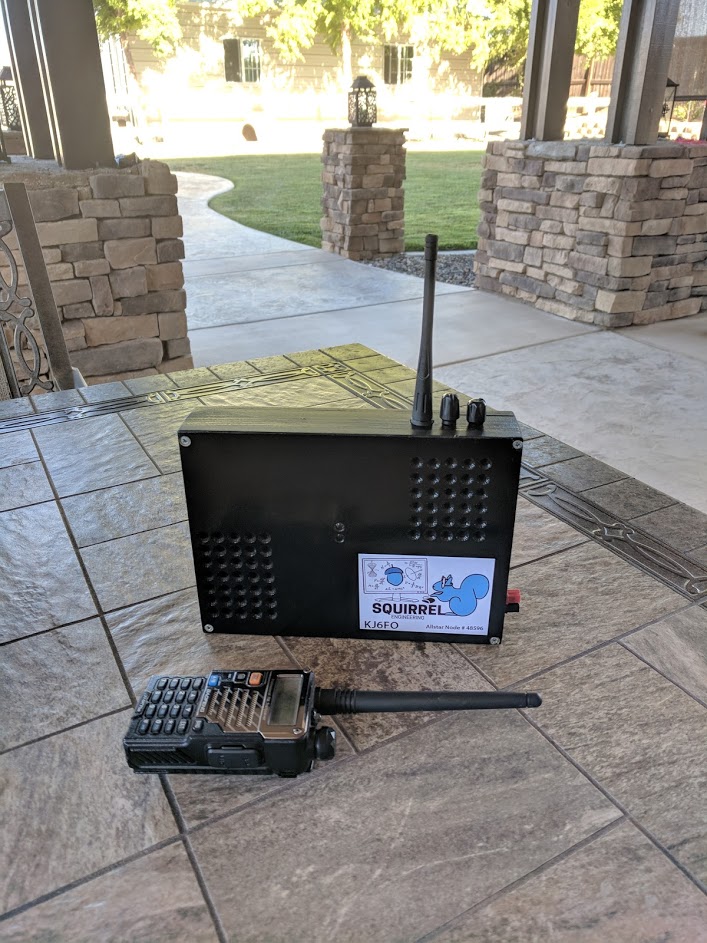 The portable Allstar node in final form. A Baoufeng UV-5R radio is shown for size comparison.